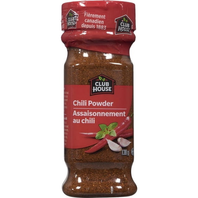 Club House Chili Powder in a 138 g clear plastic container with a red label and cap, featuring the Club House logo, red chili peppers, garlic cloves, and green leaves, containing a finely ground reddish-brown spice blend ideal for Mexican, Tex-Mex, and Southwestern seasoning.