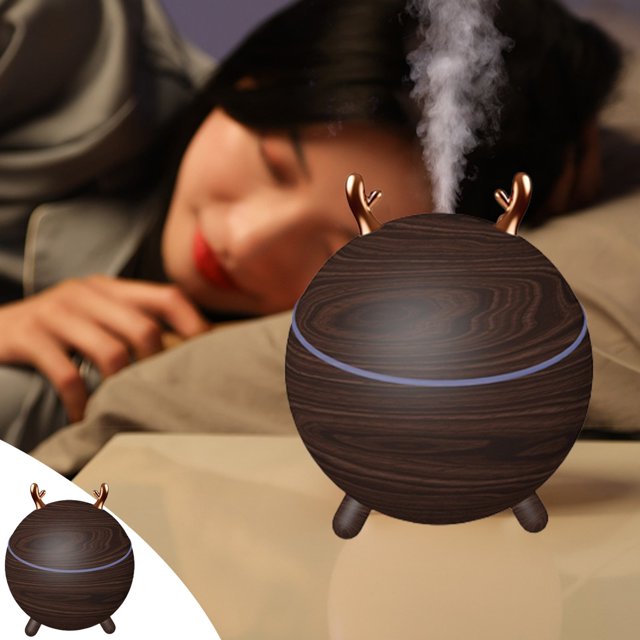 LSLJS Bedroom Mini Humidifier in a compact, spherical design with a dark brown wood grain finish and small tripod legs. The humidifier features a decorative gold antler accent and emits a visible mist. Suitable for use in bedrooms, offices, cars, and other indoor spaces. Dimensions are 10x10x11.8 cm, and it includes dual spray modes, an auto shut-off feature, and quiet operation for a restful environment.