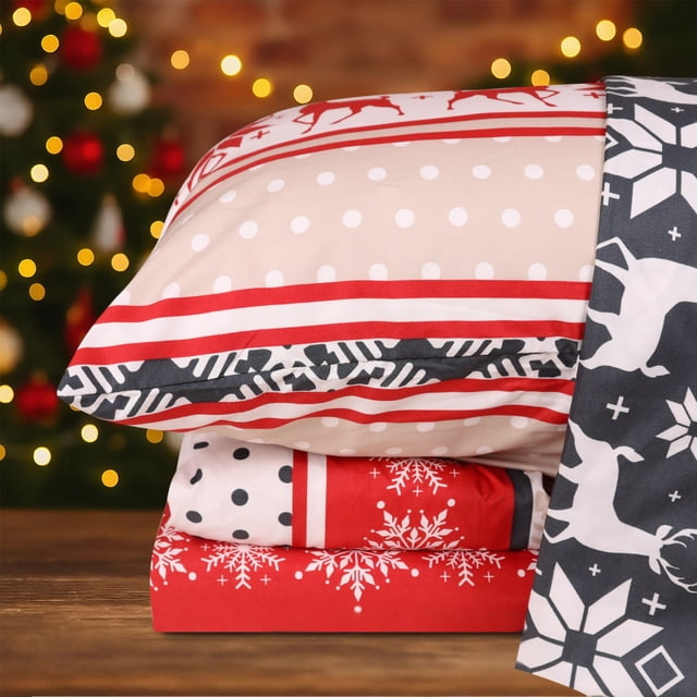 Hitime Full Size 4-Piece Christmas Sheet Set featuring ultra-soft and breathable polyester fabric with a festive classical stripe design. The set includes a flat sheet, fitted sheet with deep pockets for mattresses up to 16 inches, and two pillowcases. The red, white, and black patterns showcase snowflakes, reindeer, and polka dots, perfect for holiday decor. Wrinkle and fade-resistant, this all-season bedding offers cooling comfort and durability.