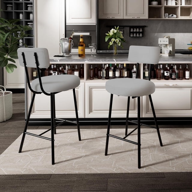 Bingirl Set of 2 Modern Upholstered Bar Stools in grey, featuring round lambswool upholstered seats with thick sponge cushions, curved backrests, and sturdy metal frames with H-shaped bases. Designed for counter height use, these stools provide ergonomic support, stylish kitchen seating, and a weight capacity of up to 350 lbs. Displayed in a modern kitchen setting with a marble countertop and bar area in the background.