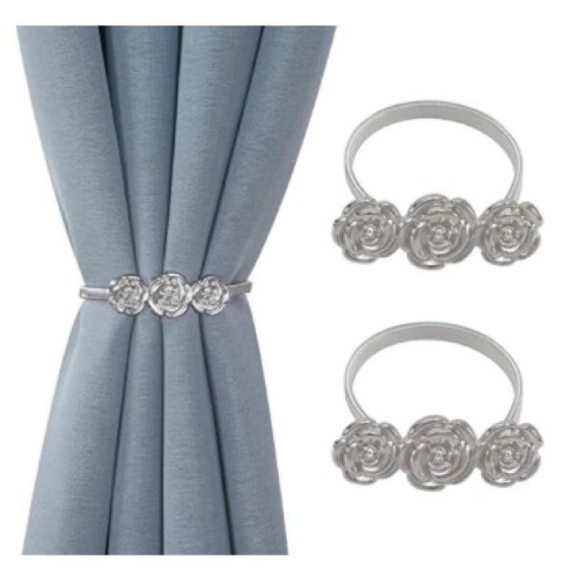 IH Casa Decor Set Of 2 Curtain Tiebacks Roses Silver, silver metallic tiebacks with three rose-shaped accents, shown holding back light blue curtains and separately displayed on white background, ideal for window coverings and drapery hardware, easy to wash fabric material.