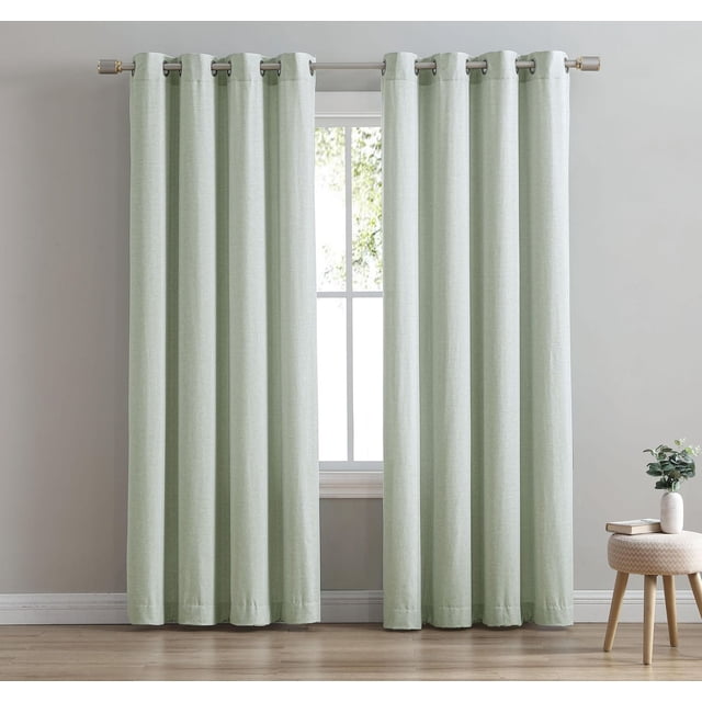 Faux Linen Single Window Panel in soft green with grommet top hanging on a metal rod, blackout curtain made of 100% polyester with linen-like texture, measuring 54 in wide, displayed in a bright room with light wood flooring and a small round stool with a vase and books, ideal for privacy and light control.