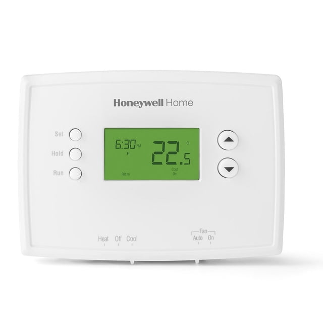 Honeywell Home RTH2300B 5-2 Day Programmable Thermostat with white rectangular body and green backlit digital display showing 22.5°C and 6:30 PM. Features soft-touch arrow buttons, Set, Hold, Run buttons, and mode indicators for Heat, Off, Cool, and Fan. Enables separate weekday and weekend heating and cooling schedules for home comfort.
