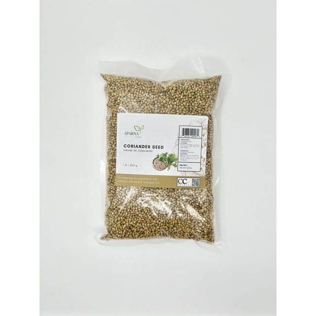 A 1lb bag of coriander seeds from Aparna Foods, packaged in a clear plastic bag with a label displaying the product name, brand logo, and details. The seeds are light brown and uniform in size, suitable for planting or culinary use.