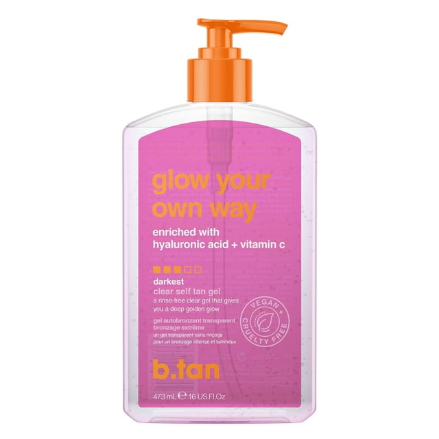 B.Tan Glow Your Own Way the OG Glow Clear Self Tan gel 16 oz in a clear plastic bottle with an orange pump dispenser, featuring a pink label with orange and white text highlighting hyaluronic acid and vitamin C, delivering a dark, rinse-free, transfer-resistant self tan gel that hydrates and bronzes skin while being vegan and cruelty-free.