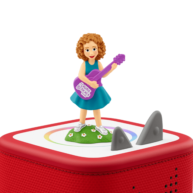 Tonies Figurine Audio - Laurie Berkner 2 with a multicolour figurine of a girl in a teal dress holding a purple guitar labeled Laurie Berkner Band, standing on a green base with white flowers atop a red Toniebox audio player with grey control ears.