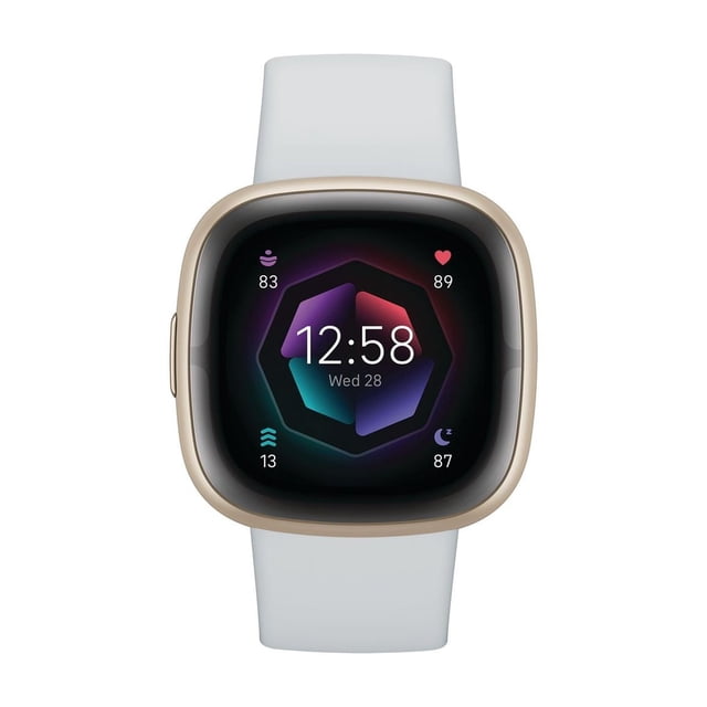 Google Fitbit Sense 2 smartwatch with gold-tone square case and white silicone band, displaying time 12:58 and date Wed 28 on a colorful hexagonal digital interface showing heart rate, stress, activity, and sleep tracking metrics for health monitoring.