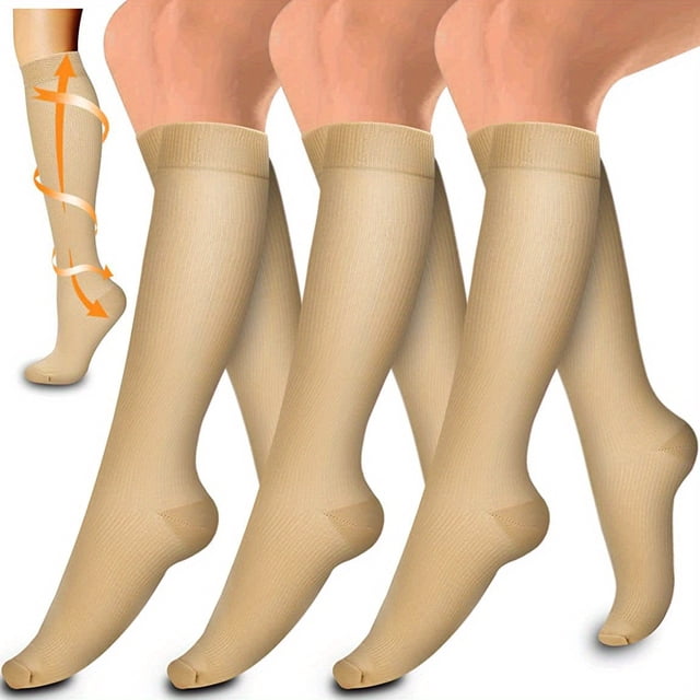 3 pairs of copper compression socks for blood circulation support, offering 15-20mm Hg compression therapy. Designed for women and men, shown in beige with a knee-high fit. The image features an orange arrow graphic emphasizing health benefits and graduated compression for improved circulation.
