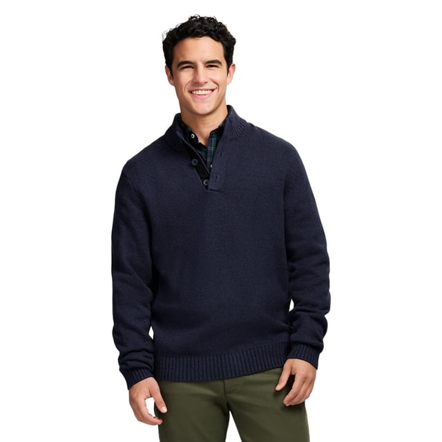 IZOD Button Popover navy blue men's sweater pullover with a mockneck collar and button closure, made from soft 100% cotton 5-gauge knit fabric, featuring ribbed cuffs and hem, worn over a dark plaid shirt with olive green pants, suitable for layering in cold weather.