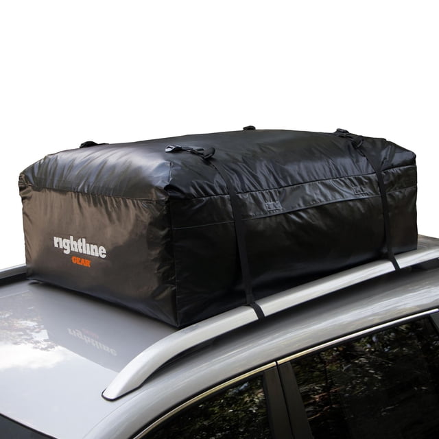 Ace 2 Car Top Carrier by Rightline Gear, a black weatherproof cargo bag made from UV-protected PVC semi-coated mesh, secured with four straps on a silver SUV roof with roof rails, designed for SUVs and minivans with or without roof racks, featuring welded seams and a hook-and-loop zipper flap.