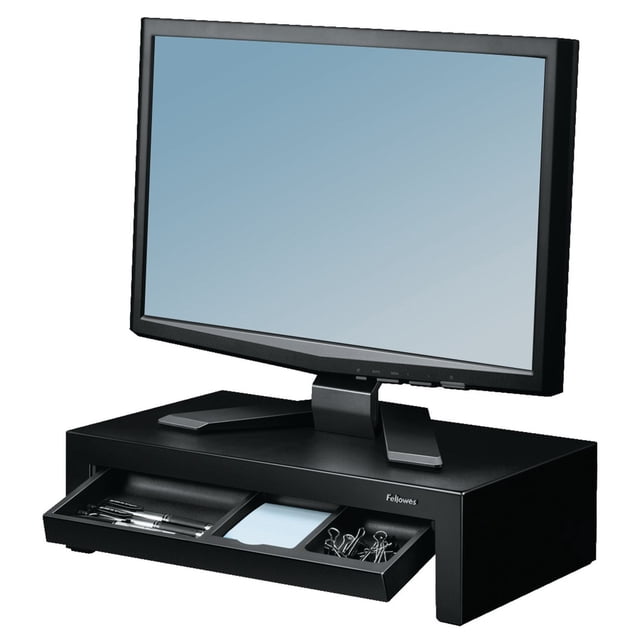 Designer Suites™ Monitor Riser in black with adjustable height up to 1-5/8 inches supporting a computer monitor. It includes a pull-out storage tray with compartments for pens, sticky notes, and binder clips, plus non-skid feet to protect the desk surface while maximizing workspace. Also suitable for organizing small office supplies.
