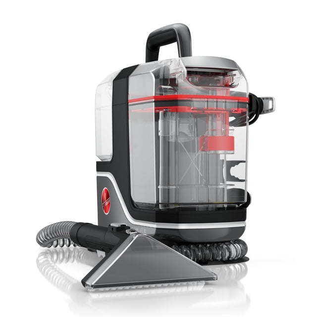 HOOVER CleanSlate XL Carpet & Upholstery Spot Cleaner in grey and black with a transparent tank showing red and silver internal components, featuring a top handle and flexible hose attached to a wide triangular cleaning tool, designed for portable deep cleaning of carpets and upholstery.