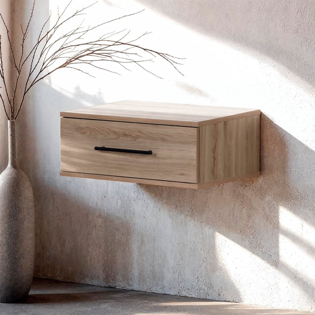 South Shore Haven Table d'Appoint Flottante avec 1 Tiroir, Fini Chêne Rustique, Murale avec une Poignée Métallique Horizontale Noire, Présentée dans une Pièce Éclairée par le Soleil avec des Murs beige Texturé et un Grand vase Décoratif à branches Nues, Convient pour Organiser les Clés et les Petits Articles dans une Entrée.