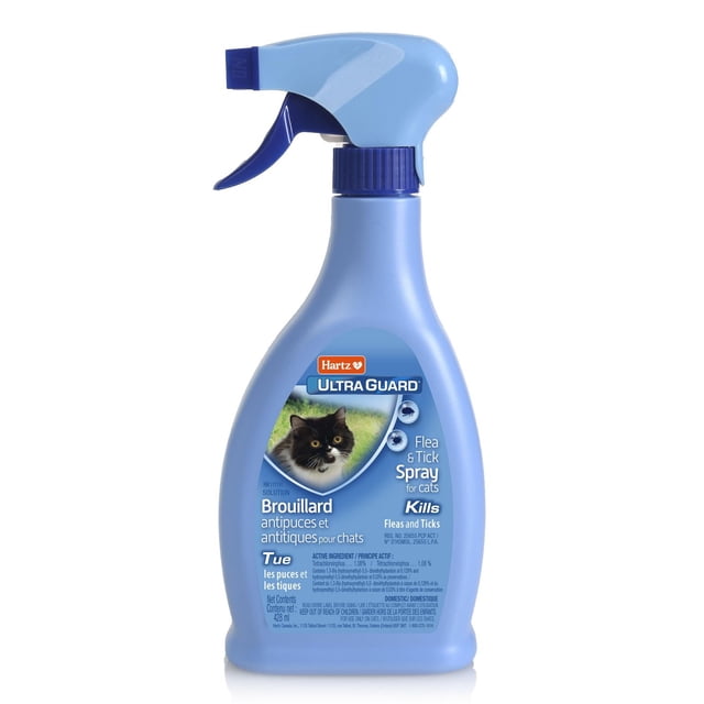Hartz Ultra Guard Flea & Tick Cat Spray 428ml in a light blue spray bottle with a dark blue trigger, featuring a label with a black and white cat image and bilingual text describing its use to kill and prevent fleas and ticks on cats, soothe itchy skin, and provide weekly preventative treatment.