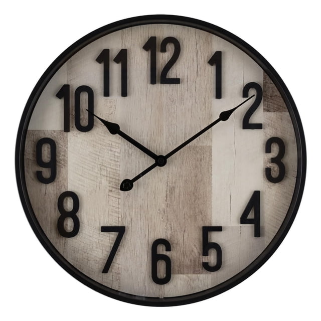 Home Trends Horloge Murale de 16 Pouces Gris Délavé avec Cadre en Plastique satin Noir et Lentille en Verre. Elle Présente un Cadran en Planches de Bois Gris Délavé Photoréaliste, des Chiffres Arabes en satin Noir Audacieux et des Aiguilles des Heures et des Minutes en Goutte Métallique Noire. l'Horloge de 16 Pouces de Diamètre Utilise un Mouvement à quartz pour une Mesure Précise de l'Heure et Est Idéale pour les Entrées, les Salons Ou les Bureaux à Domicile. Elle Convient Aussi comme Élément Décoratif dans les Espaces Créatifs.