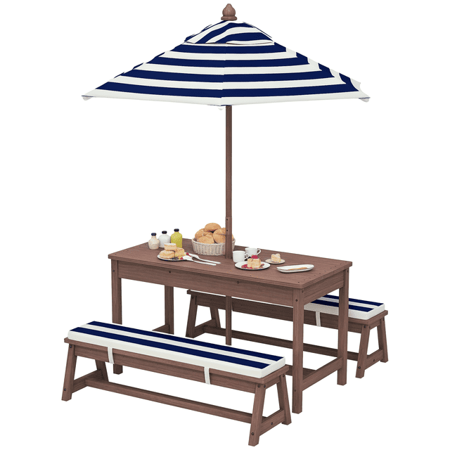 Qaba Kids Picnic Table, Wooden Table & Bench Set w/ Umbrella Cushions, Blue. A wooden picnic table set featuring two cushioned benches and a striped navy blue umbrella for shade. Designed for children aged 3-6, it accommodates up to four kids for outdoor or indoor activities. The fir wood construction ensures durability, while the removable umbrella provides protection from sun and rain. Includes a table measuring 35 inches wide, benches with 110 lbs weight capacity each, and cushions for added comfort.