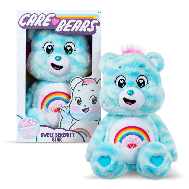 Care Bears Medium Plush (Eco) - Sweet Serenity Bear, a 14-inch blue and white striped plush bear with heart-shaped eye accents, a blue heart-shaped nose, and a rainbow belly badge featuring sensory paw pads and ears. Made from soft sustainable materials, shown inside and outside its packaging, suitable for cuddling and promoting calm.