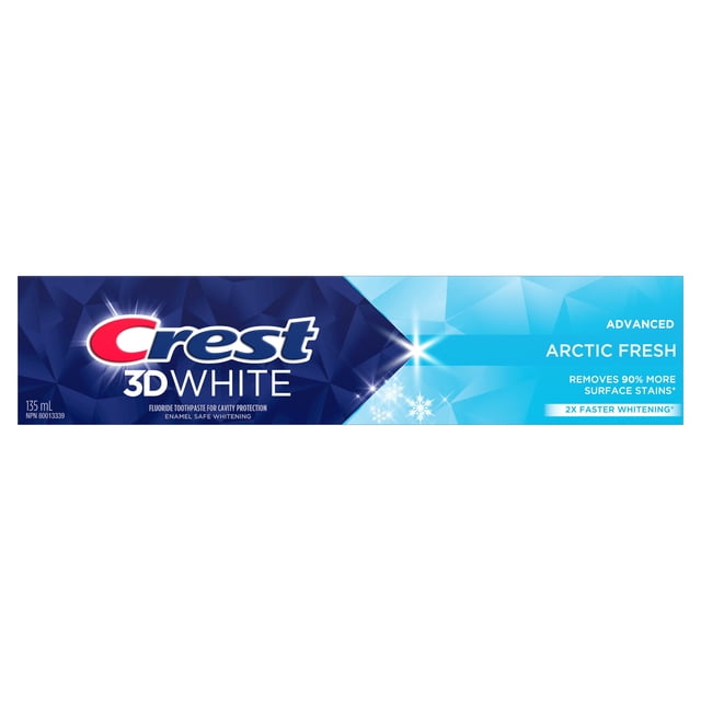 Crest 3D White Advanced Teeth Whitening Toothpaste Arctic Fresh 135 ml box with blue geometric pattern and snowflake graphics, featuring fluoride for cavity protection, enamel-safe whitening, 90% more surface stain removal, and 2X faster whitening.