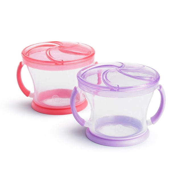 Munchkin Snack Catcher, 2 Pack, two spill-proof toddler snack containers with soft flexible flaps for easy access, dual handles, and no-slip rubber bases in pink and purple, designed for independent self-feeding and mess reduction at home or on the go.