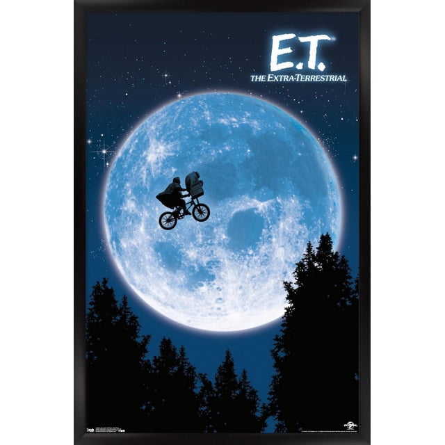 E.T. The Extra-Terrestrial Wall Poster, 22.375" x 34", depicts a silhouette of a boy riding a bicycle with an alien in the basket flying across a large blue moon against a starry night sky with tree silhouettes below, printed on glossy poster paper suitable for home décor and party use.