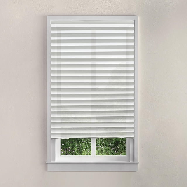 Mainstays Cordless Pleated Paper Shade, white, 36 by 72 inches, installed on a white window frame. The light-filtering pleated paper shade features horizontal folds and a cordless EZ Clip System for a clean, modern look that softly diffuses sunlight while maintaining privacy. Suitable for windows up to 36 inches wide and can be trimmed to fit.