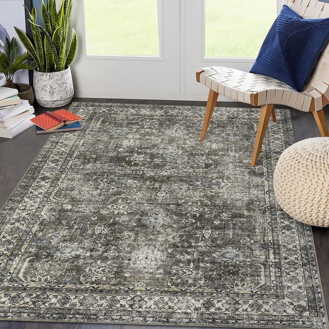 Garvee 9'x12' area rug with a vintage Persian design, boho floral patterns, and distressed brown and green tones. Made of high-quality polyester fibers, this low-pile rug is machine washable and features a non-slip backing. Ideal for living rooms, kitchens, and high-traffic areas, it complements farmhouse and mid-century modern decor styles.