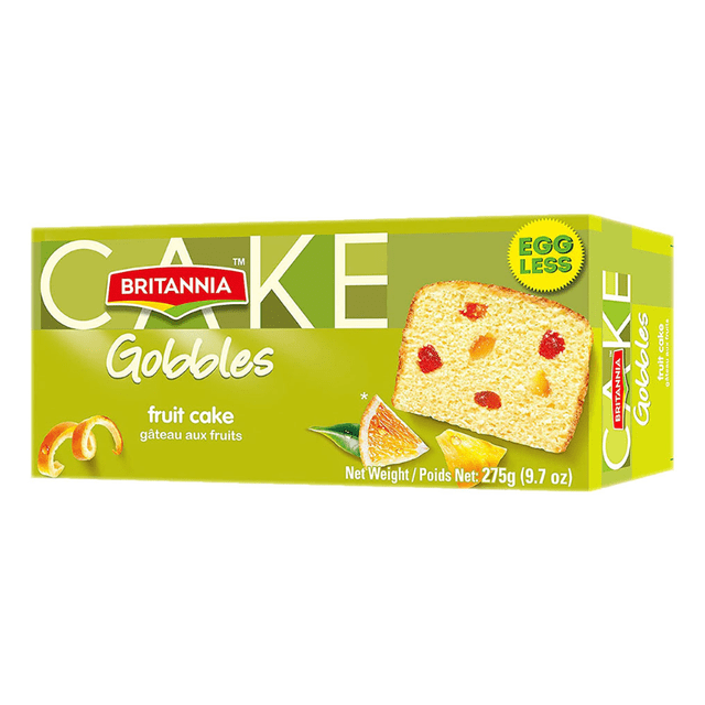 Britannia Fruit Cake Eggless in green rectangular box showing a front slice of soft, moist fruit cake with raisins, candied orange peel, and cherries, weighing 275g (9.7 oz), a vegetarian Indian sweet in the Mithai and Sweets category.