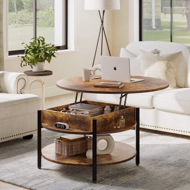 GUNAITO Round Lift Top Coffee Table with Storage in rustic brown finish, designed for living rooms as a functional accent table. Features a lift-up top for flexible use as a workspace or dining surface, hidden storage compartments, and a two-tier design for organizing items like magazines and remotes. Suitable for indoor or outdoor use, such as on a balcony for leisure activities. Displayed in a bright living room with neutral furniture and natural light.
