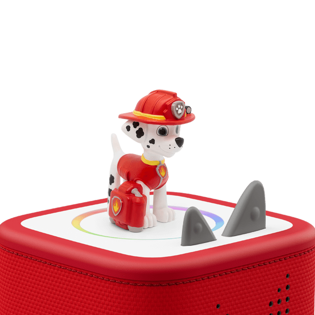 Tonies Paw Patrol Marshall Audio Figurine (FRENCH ONLY) showing a front-facing Dalmatian pup wearing a red firefighter helmet and vest, holding a red fire extinguisher, standing on a red and white Toniebox audio player with gray control ears, designed for screen-free French-language entertainment for kids ages 3 and up and suitable for encouraging creativity and cognitive skills.
