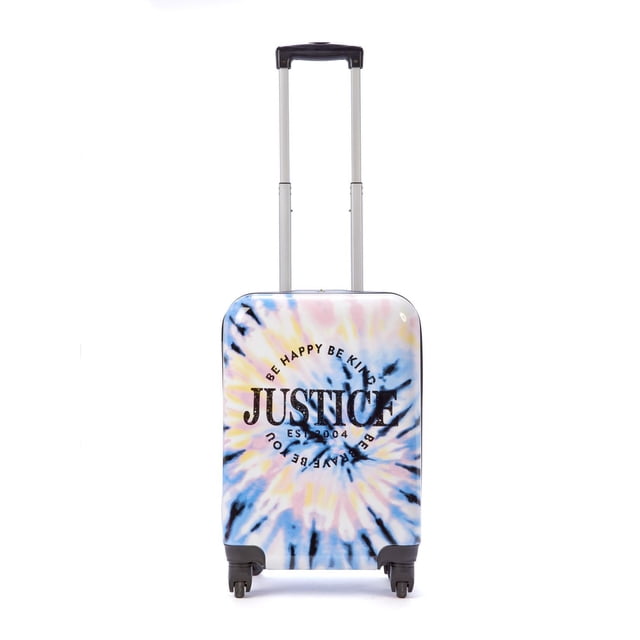 JUSTICE™ brand girls tie dye pastel hard shell 20" luggage with a front-facing spiral tie-dye pattern in pastel blue, pink, yellow, and black. The hard shell case features the Justice logo and the phrases 'Be Happy Be Kind Be Brave Be You' encircling it. It has a black telescoping handle extended and four 360° spinner wheels for easy travel. Carry-on size includes a fully lined interior with a zippered divider for organized packing, measuring 13"L x 20"H (38.5" with handle) x 9"W.