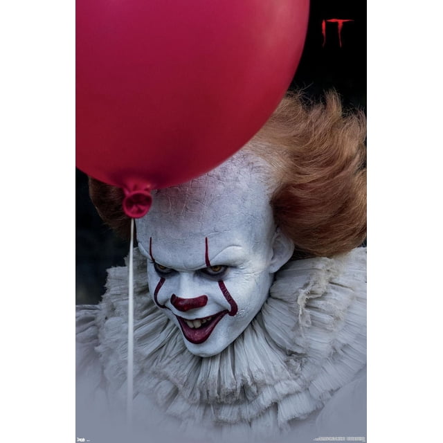 IT - Balloon Wall Poster, 14.725" x 22.375" featuring a close-up of a character with cracked white makeup and bright orange hair, wearing a layered ruffled collar, partially obscured by a large red balloon against a dark background with the red 'IT' logo, suitable for horror-themed room decor or party decoration.