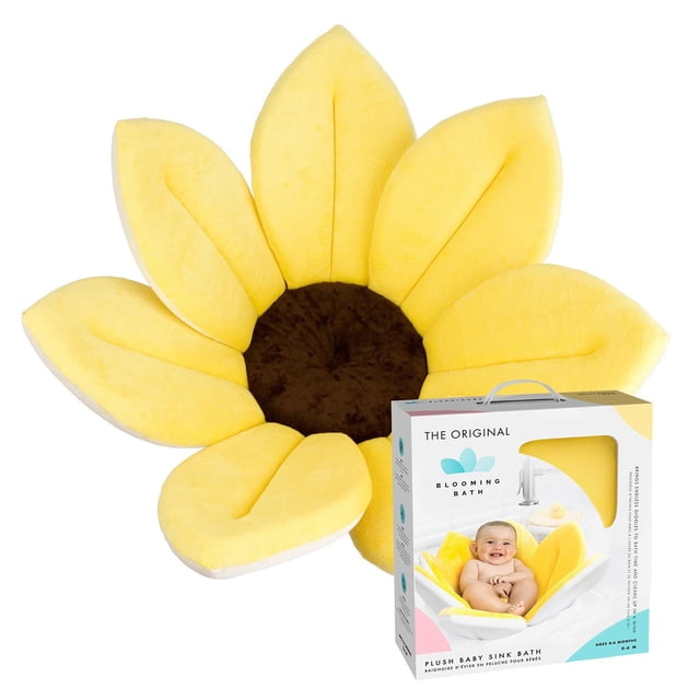 Blooming Bath The Original Baby Bath Seat in Yellow Canary, a plush sunflower-shaped baby bathtub insert with soft yellow petals and a brown center, designed to fit most sinks and keep newborns comfortable and secure during bath time.