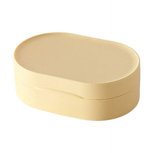EGNMCR Travel Soap Box With Lid Mini Portable Soap Box made of silicone in a compact oval shape. This beige soap dish features a secure, leak-proof lid, making it ideal for travel, outdoor use, or as a bathroom accessory. Its sleek design is also suitable for storing small items like jewelry or earphones.