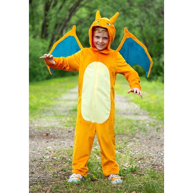Pokemon Charizard Deluxe Costume for Kids featuring an orange jumpsuit with a yellow belly, foam-backed wings in blue and orange, and a hood with stuffed horns and embroidered facial features. The back includes an appliqued foam tail with a printed flame tip. Made of 100% polyester fabric and fiberfill, with hook and loop fasteners for easy wear. Officially licensed and suitable for fancy-dress occasions.