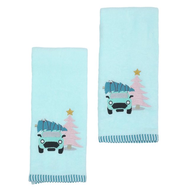 Holiday Time Hand Towels in light blue featuring an embroidered blue car carrying a Christmas tree next to a pink Christmas tree with a gold star, made of soft, absorbent 100% cotton with striped edging, suitable for bathroom use or seasonal decoration.