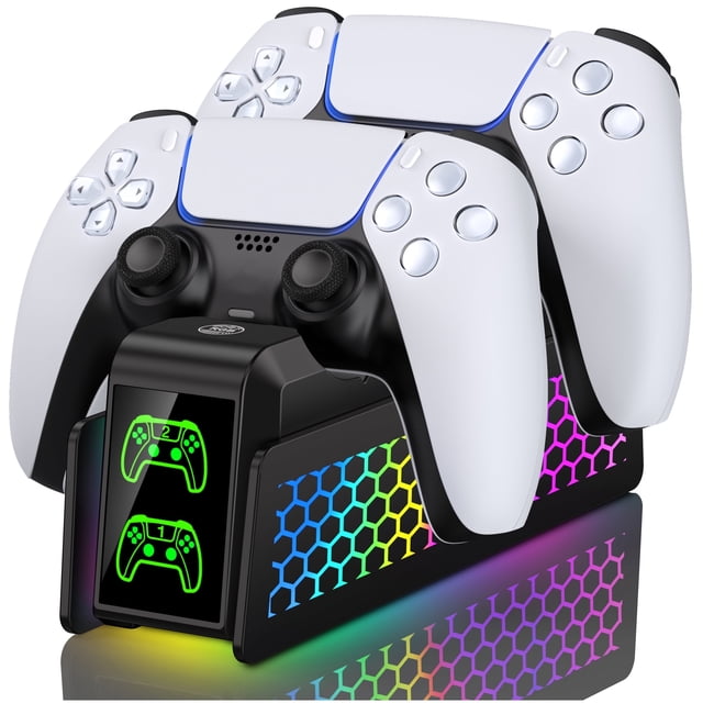 PS5 Controller Charger by GRM, a dual controller charging dock for PS5 controllers. Features a sleek black design with two white PS5 controllers docked. Includes LED charging indicators showing green and red lights for charging status. The base has a vibrant hexagonal RGB light effect, complementing the PS5 aesthetic. Designed for fast charging, it fully charges two controllers in 2.5-3 hours and includes intelligent chip protection to prevent over-current and over-voltage. Compact design with storage functionality for controllers.