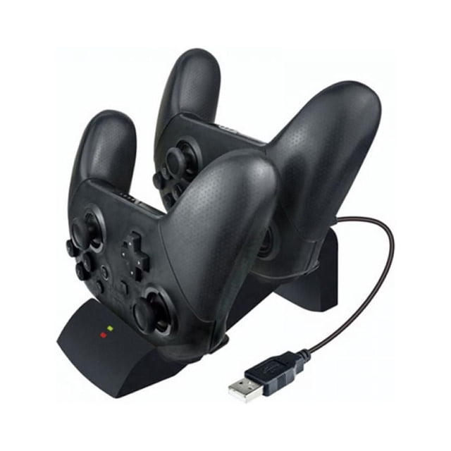 OUSITAID Fast Charger Pro Controller Charger Desktop Holder Charging Dock Dual Controller Charging Station with Indicator Lights. The image shows a compact black charging dock holding two Nintendo Switch Pro controllers. Each slot features LED indicator lights that glow red when charging and blue when fully charged. A USB cable is connected to the dock for power. Made of durable ABS material, the dock is designed for simultaneous charging of up to two controllers while saving space and keeping them organized.
