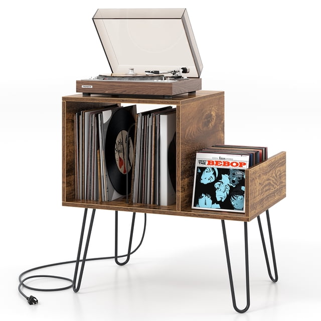 Gymax Record Player Stand Turntable Stand with built-in charging station featuring 2 AC outlets and 2 USB ports, metal legs, and a rustic brown faux wood grain finish. Designed for audio and media storage, it includes spacious compartments with adjustable dividers for vinyl records, an open shelf for CDs or audio equipment, and a roomy top for a phonograph or lamp. Durable engineered wood and metal construction with a raised height of 12 inches from the ground. Dimensions: 26'' x 18'' x 27'' (L x W x H).