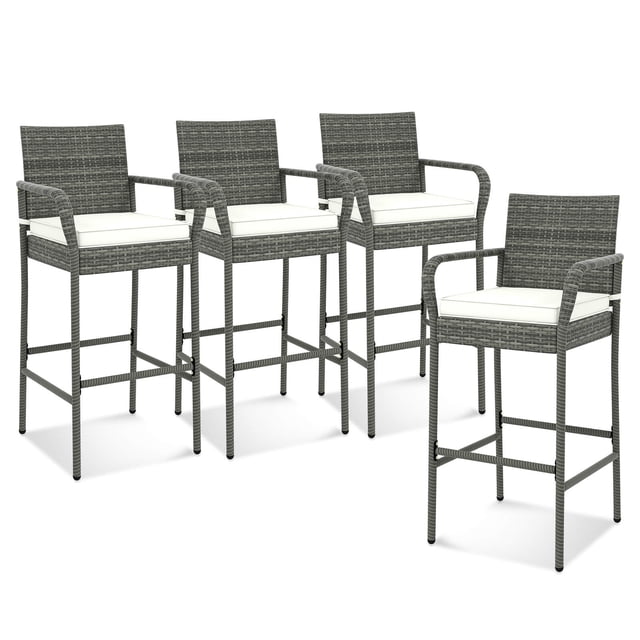 Costway 4PCS Patio PE Wicker Bar Chairs Counter Height Barstools with armrests and off-white cushions. These patio barstools feature a mix brown PE rattan surface, ergonomic backrest, curved armrests, and a sturdy metal frame with X-shaped reinforcement. Rustproof and anti-slip, they are ideal for outdoor seating in backyard, poolside, or balcony settings.