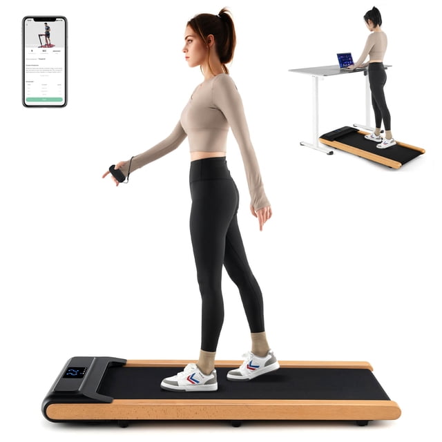 Superfit 3-in-1 Walking Pad Under Desk Treadmill with Remote Smart APP Control LED Display. A compact treadmill with a natural beech wood frame and black running belt, featuring a 7-layer shock-absorbing design for knee protection. The treadmill offers a speed range of 0.6-3.8 MPH, suitable for working, walking, or jogging. Includes a clear LED display for real-time fitness data, a remote control, and Bluetooth connectivity for the Gymax APP. Designed for easy storage with a 5-inch thickness and built-in wheels, it supports up to 220 lbs and operates quietly with a 2.25 HP motor.
