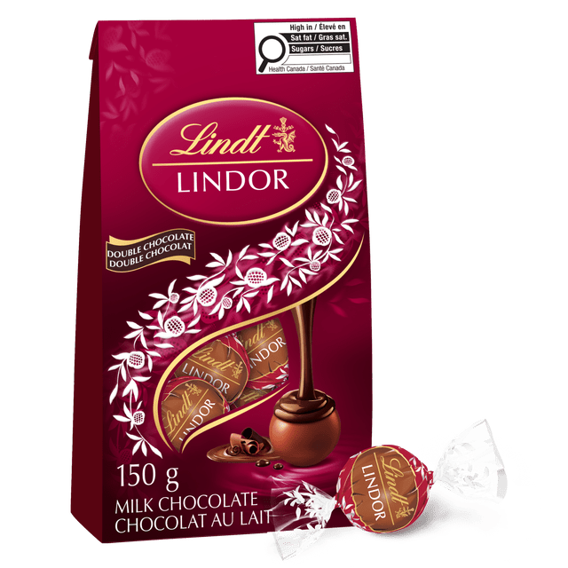 Lindt LINDOR Double Chocolate Truffles 150-gram bag with deep red packaging featuring gold Lindt logo and white floral accents, showing individually wrapped milk chocolate truffles with smooth melting dark chocolate centers, ideal for gifting or personal indulgence.