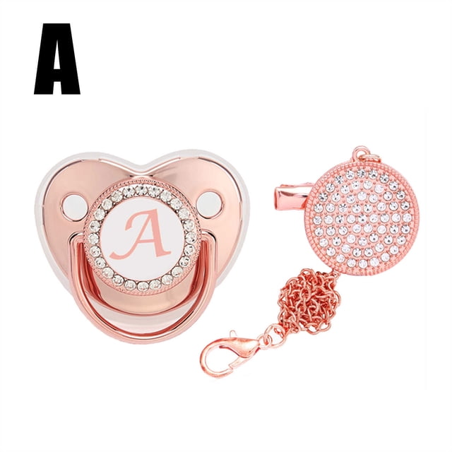 DPTALR Baby Pacifier 26 Letter Name Initial Clip Silicone Infant Nipple Bling Newborn Pacifier in rose gold with rhinestone embellishments. Features a customizable letter 'A' on the pacifier and an anti-lost clip with matching rhinestones. Made of food-grade silicone, it is safe for babies and designed to support oral development. Includes a 29 cm chain for secure attachment to clothing or strollers.