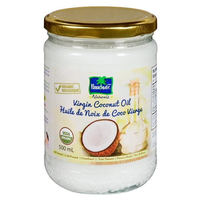 Parachute Coconut Oil 500 mL clear glass jar with gold lid, showing solidified white virgin coconut oil inside, labeled organic, cold pressed, and unrefined, featuring the Parachute logo, a halved coconut, and a glass oil bottle, suitable for cooking and natural skincare.