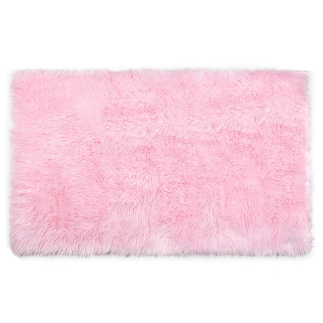 Home Decor Inc Mainstays Kids Faux Fur Rug in light pink, 30 by 45 inches, with soft, plush flokati-style texture, durable and easy to clean, ideal for kids' bedrooms, playrooms, nurseries, or study areas.