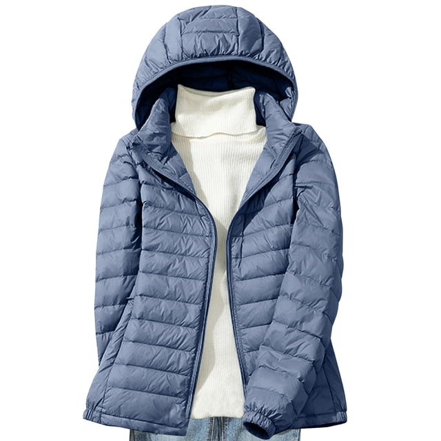 Lolmot Women's Down Jacket Lightweight Hooded Short Korean Style Extra Large Size Plus White Down Warm Jacket in a medium blue color. The jacket features a quilted design, full sleeves, and a hooded neckline. Styled with a white turtleneck sweater underneath and light blue jeans, this plus-size jacket is ideal for casual wear during winter and spring.