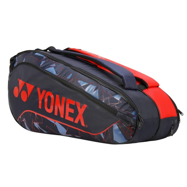 Yonex Badminton Racquet Bag 2326 T01 in Indigo Fog Hyper Red, made of polyurethane. Ideal for tennis and badminton players, it features foam-lined compartments for delicate items, a thermal lining compartment for racquet storage, a wider shoe pocket, and padded shoulder straps for backpack use.
