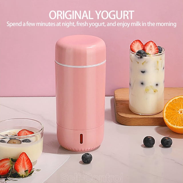 Glass Yogurt Maker Machine for Homemade Yogurt with Fruit Add-Ins, featuring a compact pink design with a 280ml capacity. The machine is shown on a countertop with a glass of yogurt containing fruit add-ins, blueberries, and strawberries, alongside an orange slice. Ideal for making personalized yogurt with ease.