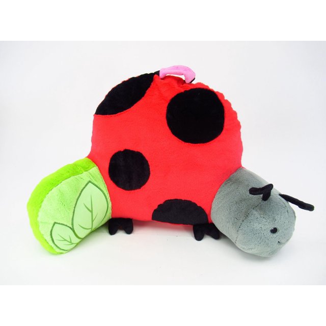 CUSHIONS LADYBUG plush cushion shaped like a ladybug with a red body and black spots, gray head with black antennae, and a green leaf-shaped tail, featuring a pink carrying handle and small black feet, ideal for chair pads or kids' room decor and lightweight to move between rooms.