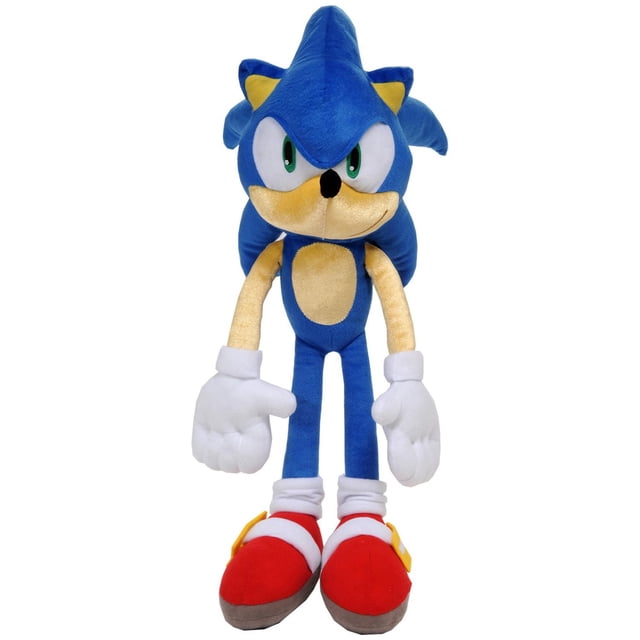 Sonic "Speed Unlimited" Cuddle Pillow showing a front-facing plush toy of Sonic The Hedgehog with blue microfiber plush, beige face and belly, green eyes, white gloves, and red shoes with white straps and yellow buckles, suitable for cuddling or bedroom décor.