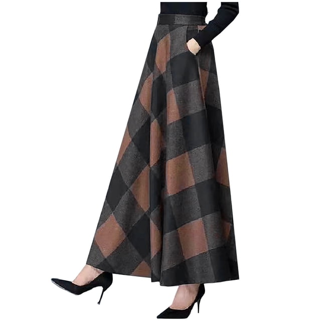 jovati Jupe Longue pour Femmes avec Poches, Taille Haute, Motif à Carreaux Noir et Brun. Fabriquée en Tissu polyester Léger, Cette Jupe Offre une Coupe Confortable et Comprend des Poches Latérales Fonctionnelles. Convient aux occasions Décontractées, de Fête Ou Formelles, Elle Est Conçue pour Toutes les Saisons. la Jupe Est Montrée Assortie à des Talons Noirs et à un Haut Noir.